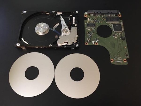 Photo of the internal components of a dead 2.5” har drive removed from a Mac mini