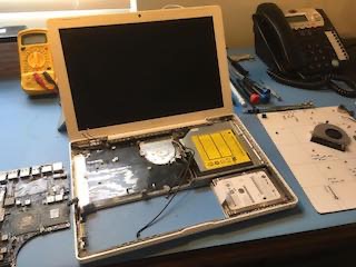 Photo of a MacBook main login board repair.